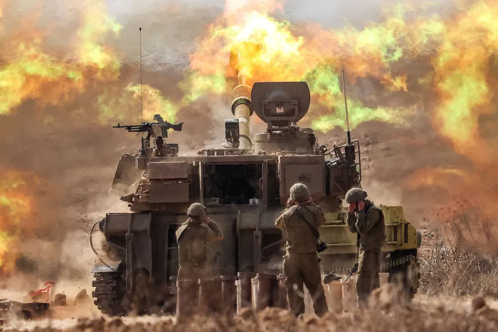 An Israeli howitzer/tank firing near the Gaza border in southern Israel on October 11, 2023.